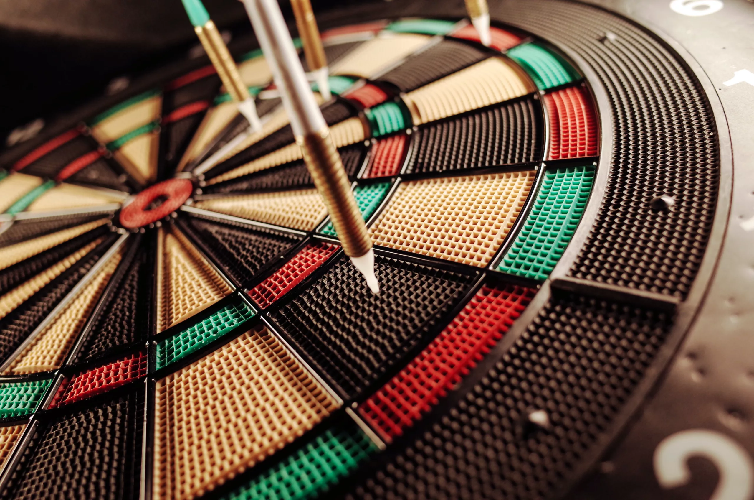 How to Speak Directly to Your Target Audience with Video Marketing. Darts in a dart board, getting closer to the bullseye.